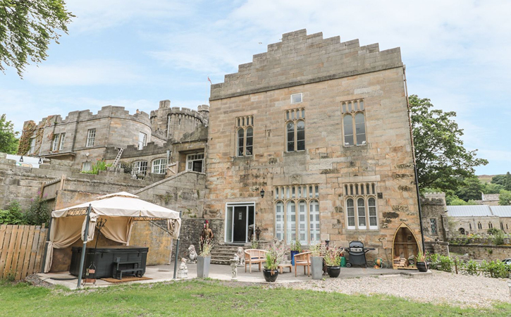 view of garden and hot tub at Stanhope Castle self catering accommodation